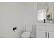 Contemporary powder room boasting a sink and stylish faucet, and a toilet at 2384 Ridgeline Wash St, Las Vegas, NV 89138