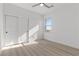 Well-lit bedroom with closet and light wood-look floors at 2384 Ridgeline Wash St, Las Vegas, NV 89138