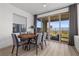 Bright dining area with contemporary table, chairs, and sliding glass doors leading to outdoor space at 2384 Ridgeline Wash St, Las Vegas, NV 89138