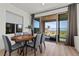 Bright dining area with contemporary table, chairs, and sliding glass doors leading to outdoor space at 2384 Ridgeline Wash St, Las Vegas, NV 89138