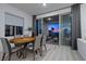 Dining area with wood table, chairs, and sliding doors leading to outdoor living space at 2384 Ridgeline Wash St, Las Vegas, NV 89138