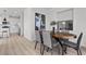 Dining room featuring an oval table with gray chairs and modern decor at 2384 Ridgeline Wash St, Las Vegas, NV 89138