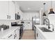 Bright kitchen with a large island, quartz countertops, and stainless steel appliances at 2384 Ridgeline Wash St, Las Vegas, NV 89138