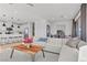 Open-concept living room with modern furnishings and a view of the kitchen at 2384 Ridgeline Wash St, Las Vegas, NV 89138