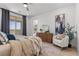 Bright primary bedroom with modern decor, plush bed, and balcony access at 2384 Ridgeline Wash St, Las Vegas, NV 89138