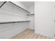 Walk-in closet with built-in shelving and light wood flooring at 2384 Ridgeline Wash St, Las Vegas, NV 89138