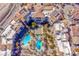 Expansive aerial view of luxury condos featuring multiple pools, palm trees and well maintained landscaping at 24 Cerchio Alto, Henderson, NV 89011