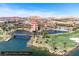 Aerial view of the Reflection Bay Golf Course and surrounding resort and homes near a bridge and a lake at 24 Cerchio Alto, Henderson, NV 89011