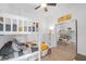 Bright bedroom with a bunk bed, ceiling fan, and mirrored closet reflecting the room at 24 Cerchio Alto, Henderson, NV 89011