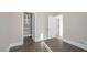 Bedroom featuring hardwood floor, a closet with adjustable shelving, and plenty of natural light at 24 Cerchio Alto, Henderson, NV 89011