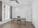 Minimalist bedroom with wood floors, natural light, and a ceiling fan at 24 Cerchio Alto, Henderson, NV 89011