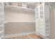 Organized walk-in closet with built-in shelving, drawers, and ample storage space at 24 Cerchio Alto, Henderson, NV 89011