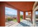 Covered patio featuring an outdoor kitchen, mountain views and decorative stone ground cover at 24 Cerchio Alto, Henderson, NV 89011