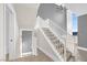 Bright staircase featuring carpeted steps and a large window offering natural light at 24 Cerchio Alto, Henderson, NV 89011