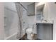 Modern bathroom with grey vanity and a shower/tub combo at 247 Dougram Ave, Las Vegas, NV 89101