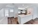 Modern kitchen with gray cabinets, white quartz countertops, and stainless steel appliances at 247 Dougram Ave, Las Vegas, NV 89101