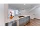 Modern kitchen island with white quartz countertop and gray cabinets at 247 Dougram Ave, Las Vegas, NV 89101