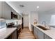 Modern kitchen with gray cabinets, quartz countertops, and stainless steel appliances at 247 Dougram Ave, Las Vegas, NV 89101