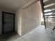 Apartment building hallway with security door and stairs at 2606 S Durango Dr # 172, Las Vegas, NV 89117