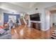 View of the open living space showing the dining area, the stairs to the upper floor and hardwood floors at 2727 Scotch Heather St, Las Vegas, NV 89142