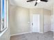 Bright bedroom featuring a ceiling fan, large window, and plush carpet flooring at 283 Fancrest St, Henderson, NV 89052