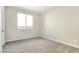 Neutral bedroom with soft carpet, bright natural light, and neutral colored walls at 283 Fancrest St, Henderson, NV 89052