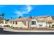 Charming home with tile roof, blue shutters, and desert-friendly landscaping in a suburban neighborhood at 283 Fancrest St, Henderson, NV 89052