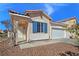 Front exterior showcasing a well-maintained lawn, blue shutters, and a two-car garage at 283 Fancrest St, Henderson, NV 89052