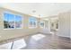 Open living room features recessed lighting, light hardwood floors, and bright windows, creating a welcoming space at 283 Fancrest St, Henderson, NV 89052