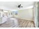 Spacious living room with modern ceiling fan, recessed lighting, and attractive wood flooring at 283 Fancrest St, Henderson, NV 89052