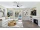 Open living room showcasing a fireplace, contemporary furnishings, and a view of the inviting backyard pool at 283 Fancrest St, Henderson, NV 89052