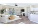 Bright living room featuring a fireplace, modern decor, and sliding glass doors leading to the backyard pool at 283 Fancrest St, Henderson, NV 89052