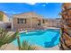 Outdoor pool features a baja step, a pergola, and mature landscaping at 283 Fancrest St, Henderson, NV 89052