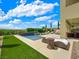 Luxury backyard with pool, patio, and artificial turf at 3 Hilltop Crest St, Henderson, NV 89011