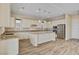 Modern kitchen with stainless steel appliances, granite counters, and pendant lighting at 3 Hilltop Crest St, Henderson, NV 89011