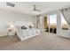 Spacious main bedroom with a luxurious bed and private balcony at 3 Hilltop Crest St, Henderson, NV 89011