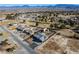 Wide aerial shot of a lovely neighborhood with homes, lush trees, and mountain views at 3101 S Spy Glass Ave, Pahrump, NV 89048