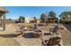 Backyard has large fire pit with seating, playground, and storage shed at 3101 S Spy Glass Ave, Pahrump, NV 89048