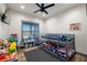 bedroom with bunkbeds and plenty of natural light from the window at 3101 S Spy Glass Ave, Pahrump, NV 89048