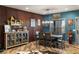 Dining area featuring wood floors, rustic table, and stylish decor at 3101 S Spy Glass Ave, Pahrump, NV 89048