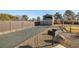 Long driveway leads to an RV cover, with a fenced yard and shed offer space and utility at 3101 S Spy Glass Ave, Pahrump, NV 89048