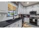 Well-lit kitchen showcasing granite countertops, stainless steel appliances, and a modern sink at 3101 S Spy Glass Ave, Pahrump, NV 89048