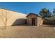 A detached shed with a neutral color complements the surrounding landscape, adding practical storage space at 3101 S Spy Glass Ave, Pahrump, NV 89048