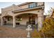 Covered back patio with stone pillars and furniture for comfortable outdoor living at 3146 Surf Spray St, Las Vegas, NV 89117