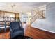 Dining room with hardwood floors, wainscoting, and a view into the living room at 3146 Surf Spray St, Las Vegas, NV 89117