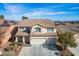 Charming two-story home featuring a well-manicured lawn, a two-car garage, and a lovely covered entryway at 3146 Surf Spray St, Las Vegas, NV 89117