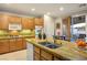 Bright kitchen featuring stainless steel appliances, a large island, and sliding doors to the patio at 3146 Surf Spray St, Las Vegas, NV 89117