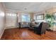 Cozy living room with hardwood floors, gray sofa set and natural lighting at 3146 Surf Spray St, Las Vegas, NV 89117