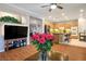 Open concept living room with hardwood floors and a view into the modern kitchen at 3146 Surf Spray St, Las Vegas, NV 89117