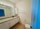 Bathroom with granite countertop, toilet and mirror at 3205 Mystic Ridge Ct, Las Vegas, NV 89129